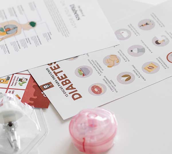 paper showing information on diabetes and pink pills container